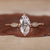 Marquise diamond engagement ring in yellow gold.
