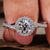 Twisted engagement ring featuring a round diamond for elegance.
