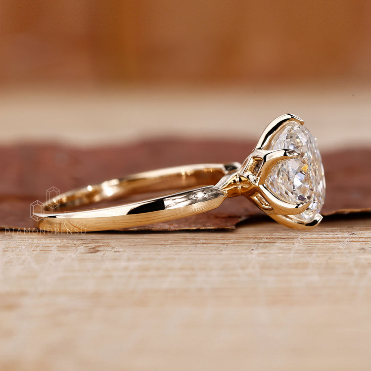 Yellow gold ring with a 6 claw prong setting.
