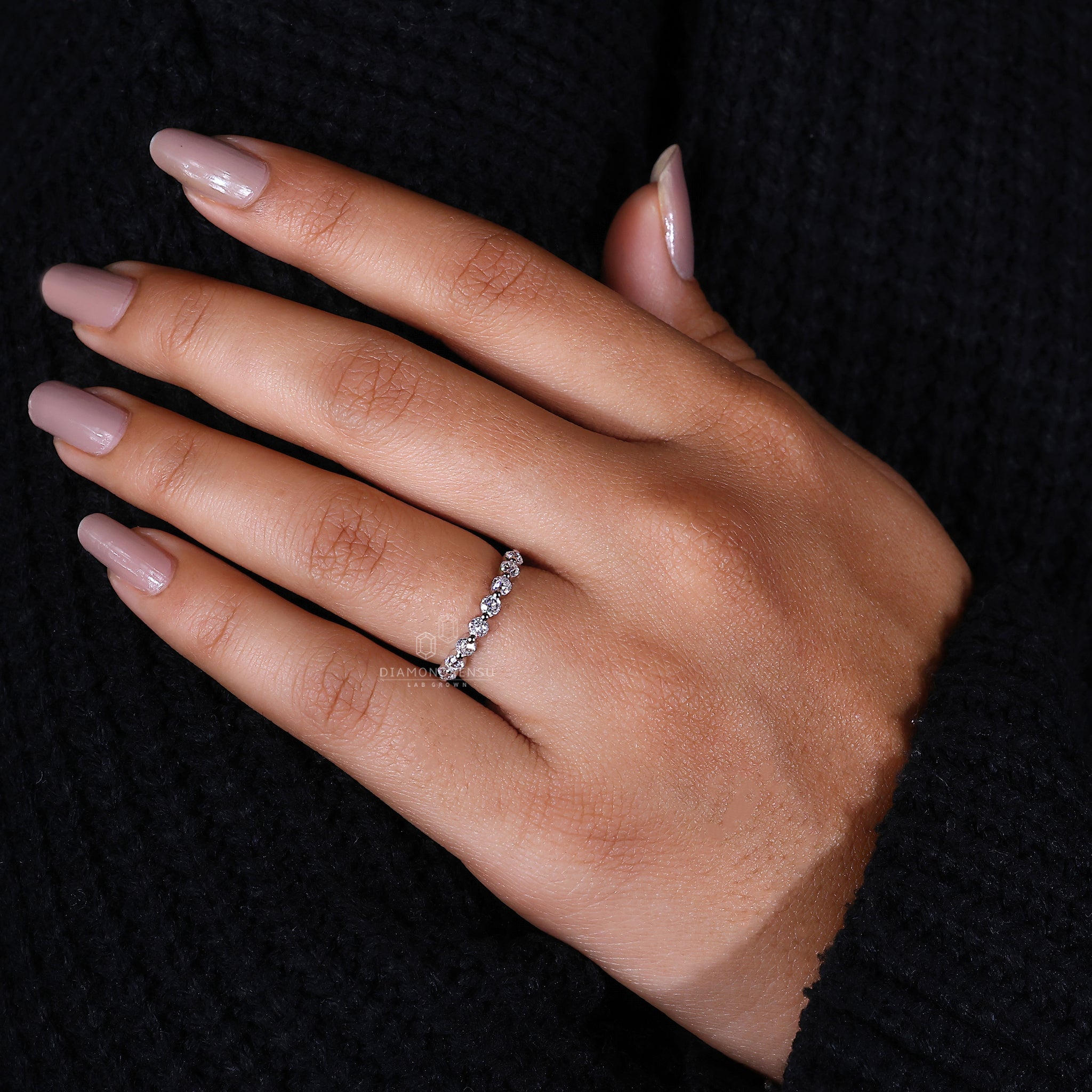 White gold band with round cut diamonds.
