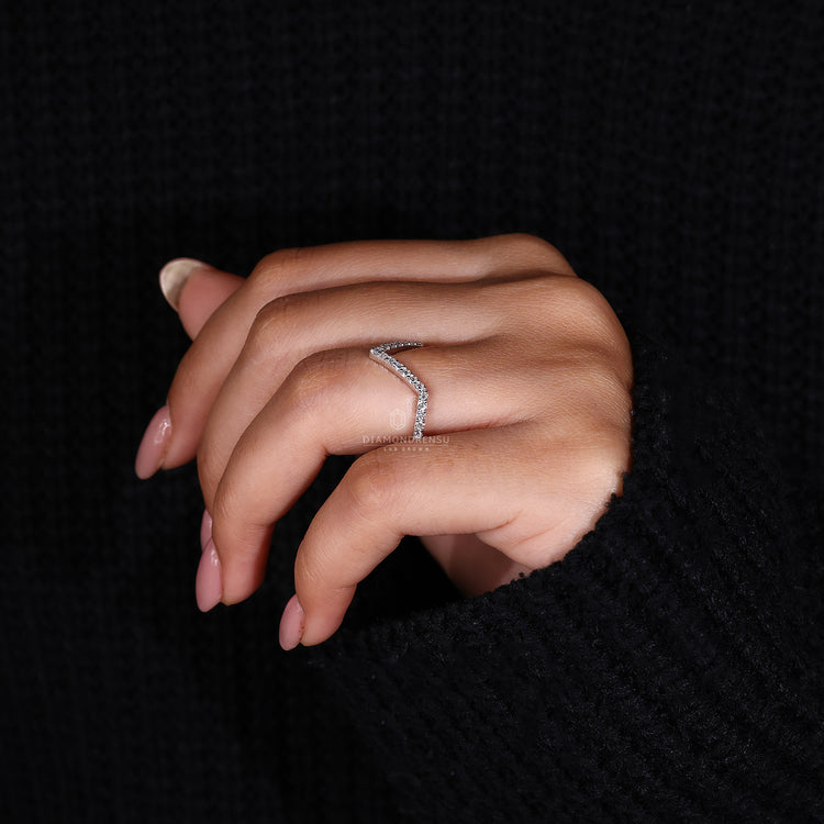 Prong set wedding band with round cut lab grown diamonds.