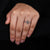 Kite side stones with compass prong setting hold the diamonds.
