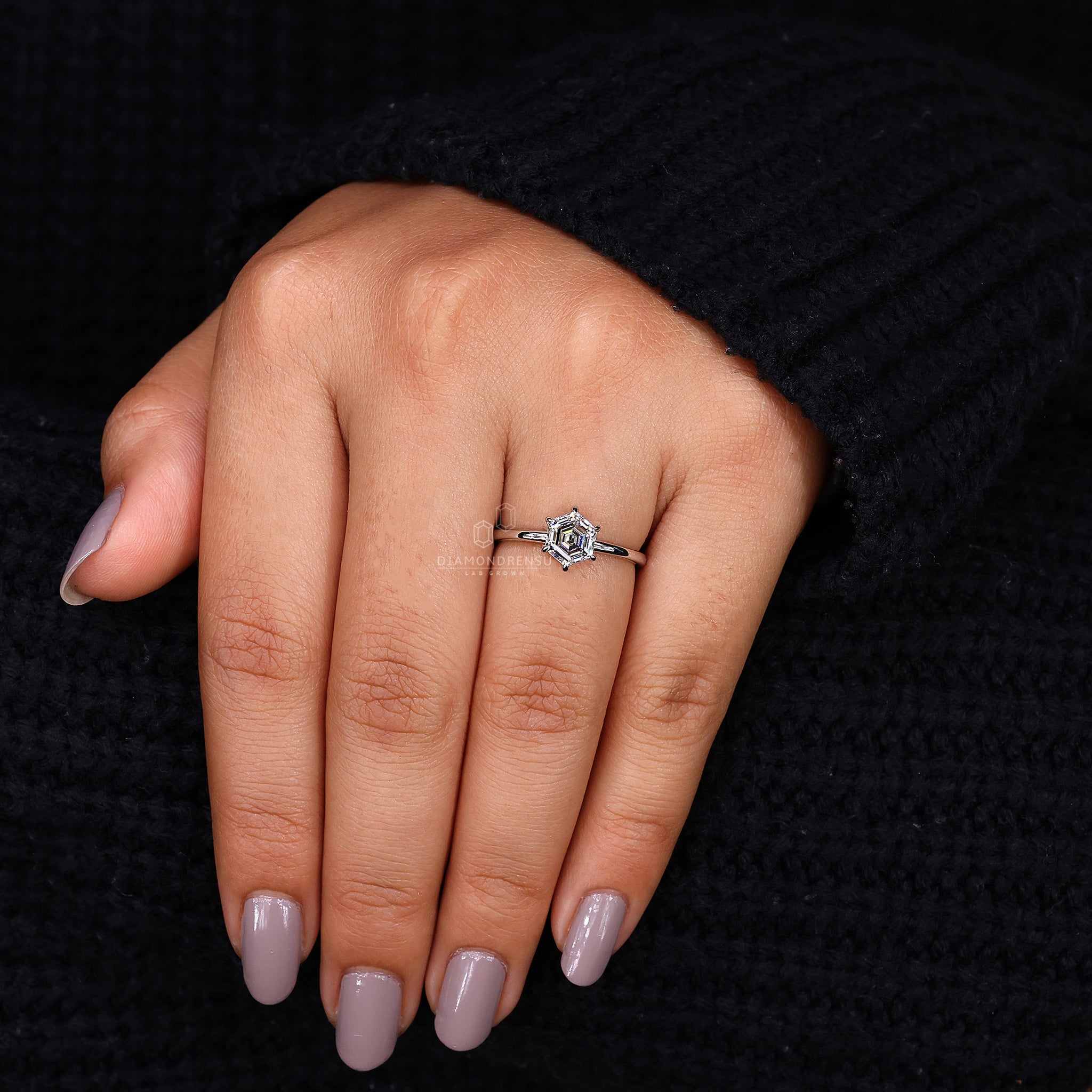 Six claw prong setting holds the diamond firmly.
