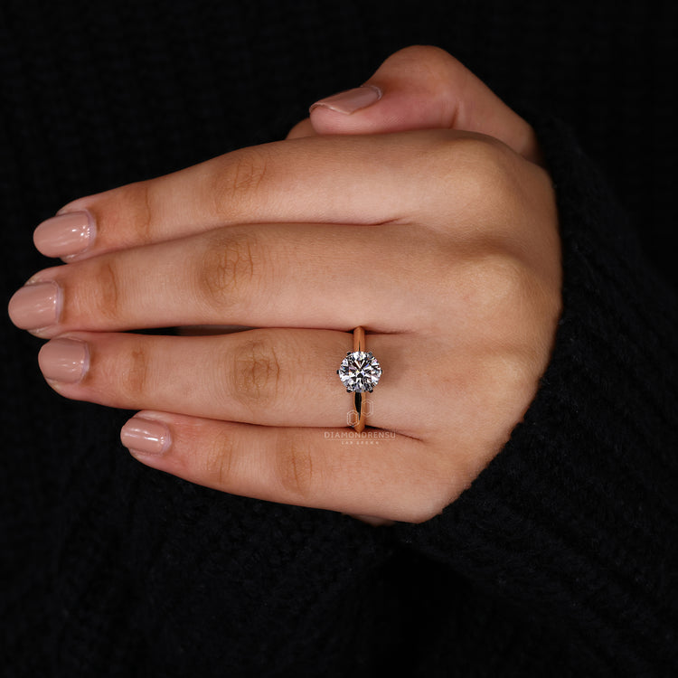 Diamondrensu UK engagement ring with two tone metal and classic prong setting.
