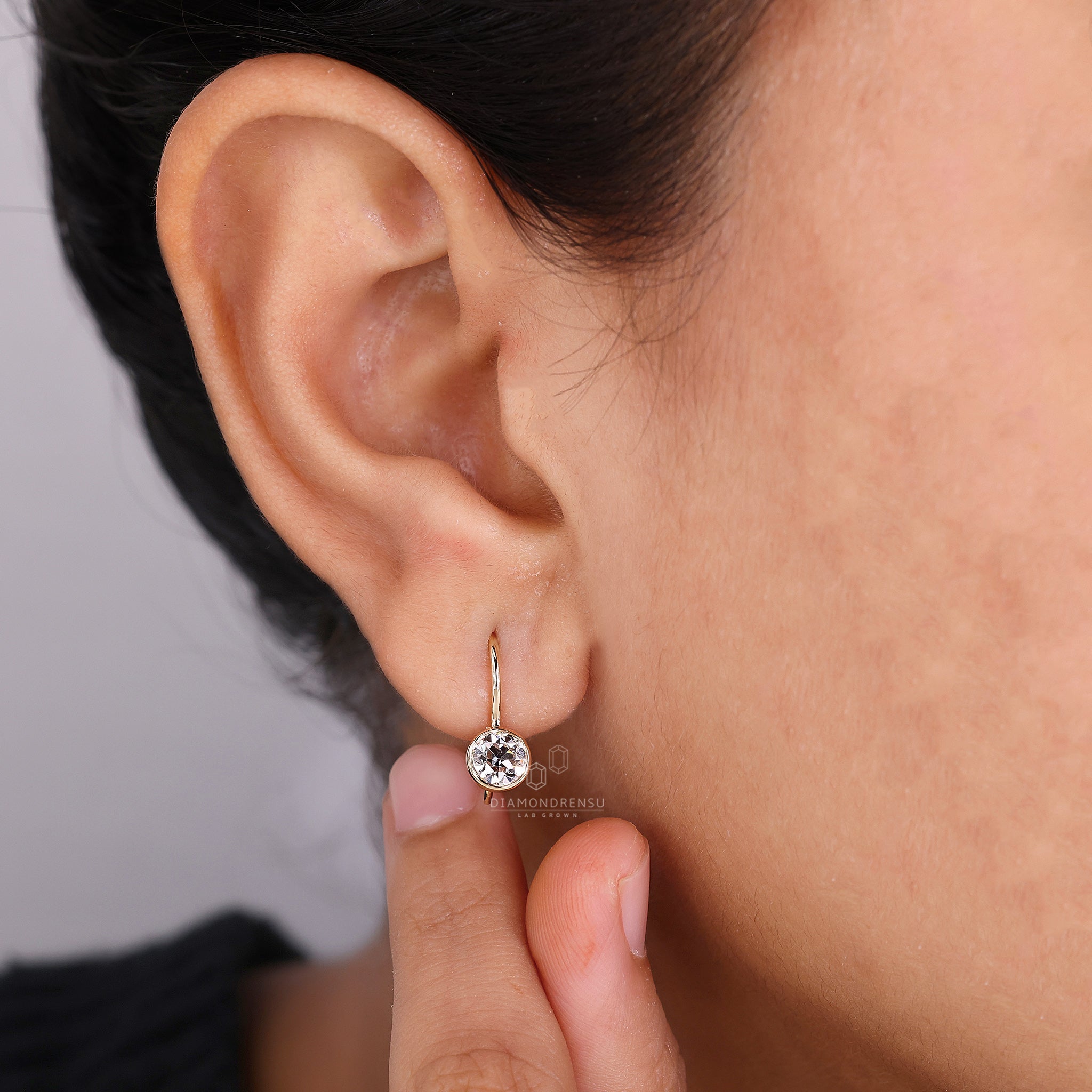 Classic wire hook diamond earrings.