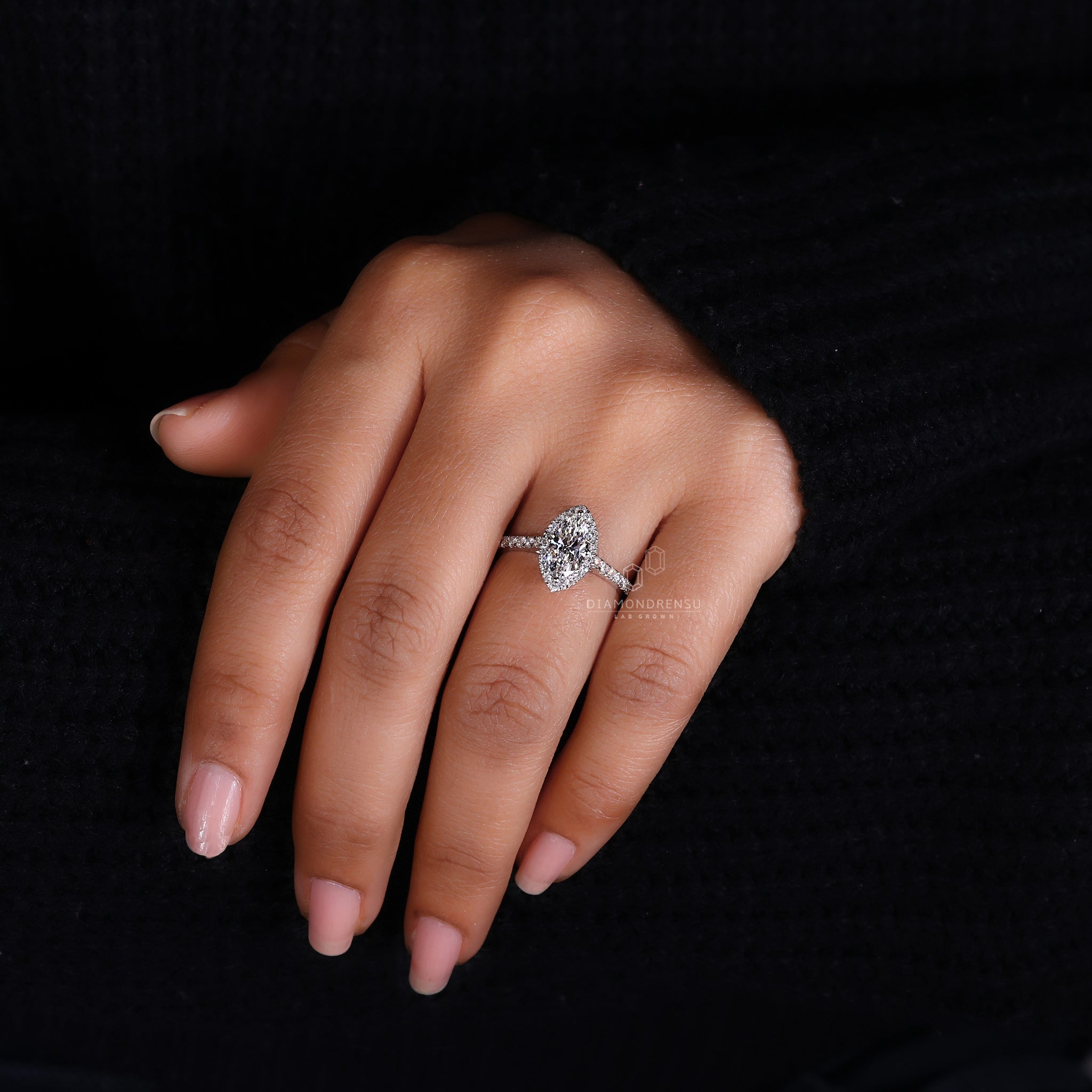 Buy diamond ring with marquise halo and pave accents.
