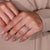 Butterfly style ring adds a creative shape to the design.
