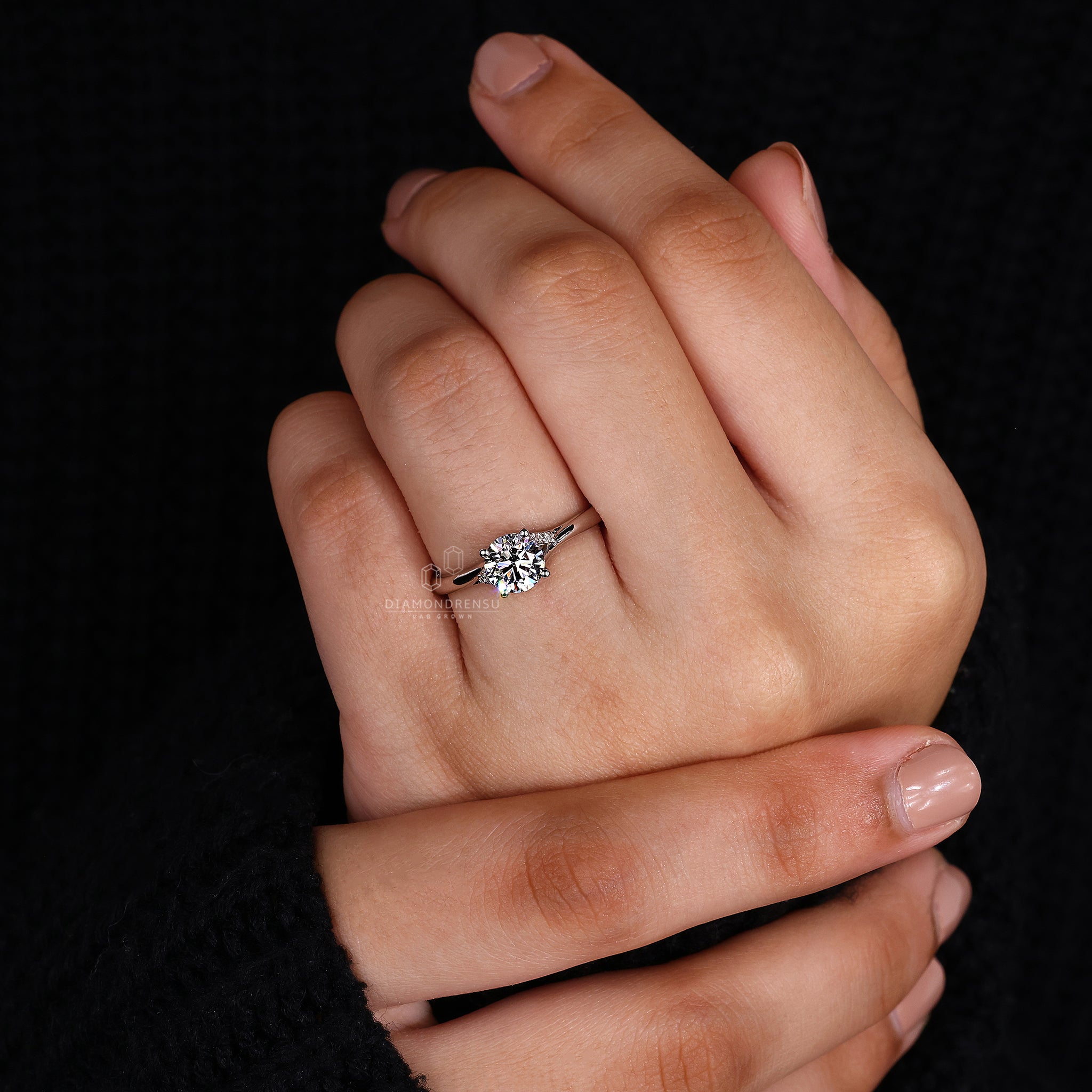 White gold ring in trellis diamond ring setting
