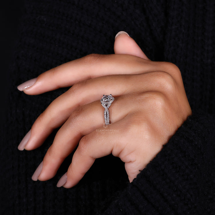 White gold ring with a halo diamond centerpiece.
