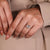 Trapezoid diamond stones are placed on both sides.
