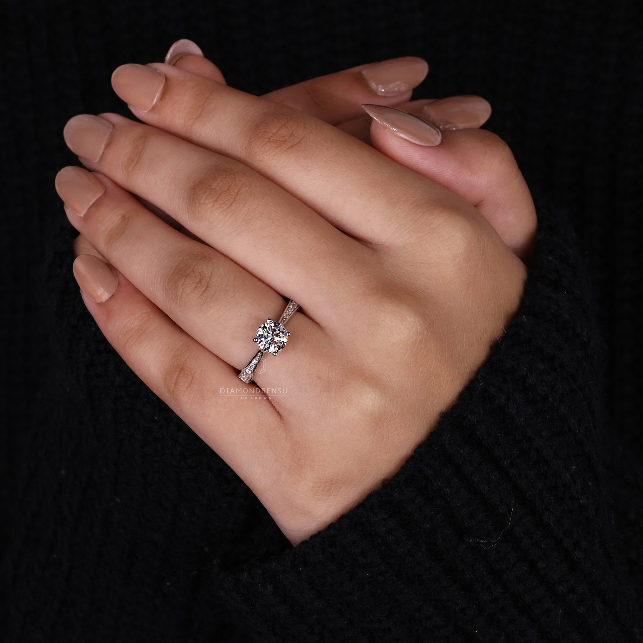 Custom engagement ring styled with 4 prong setting.
