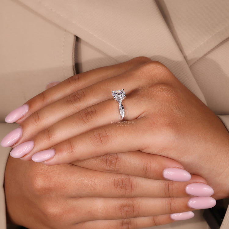 Diamondrensu UK engagement ring with white gold band and pave diamonds.
