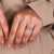White gold hexagon ring with two triangle side stones