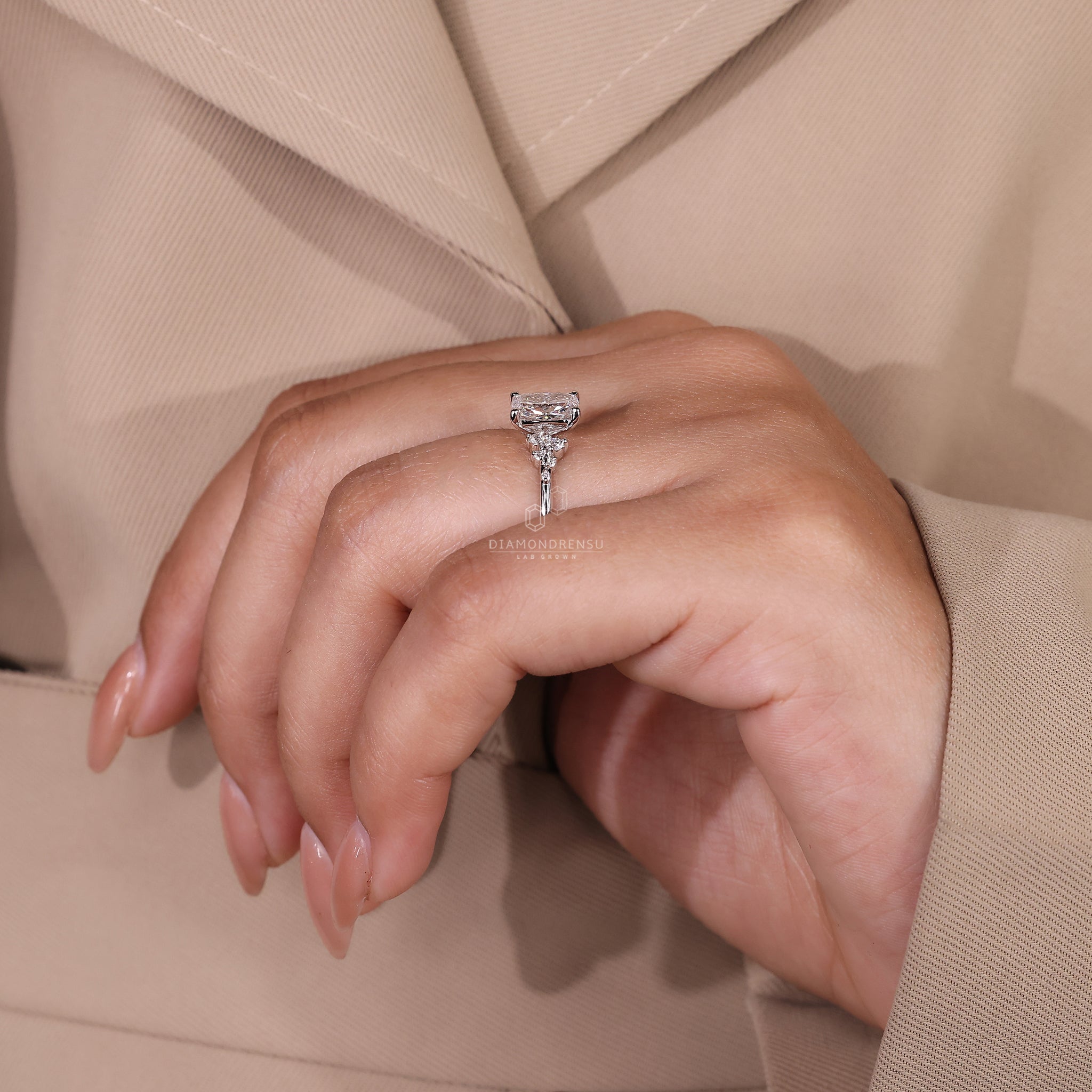 White gold ring with elongated cushion and IGI certified diamond.
