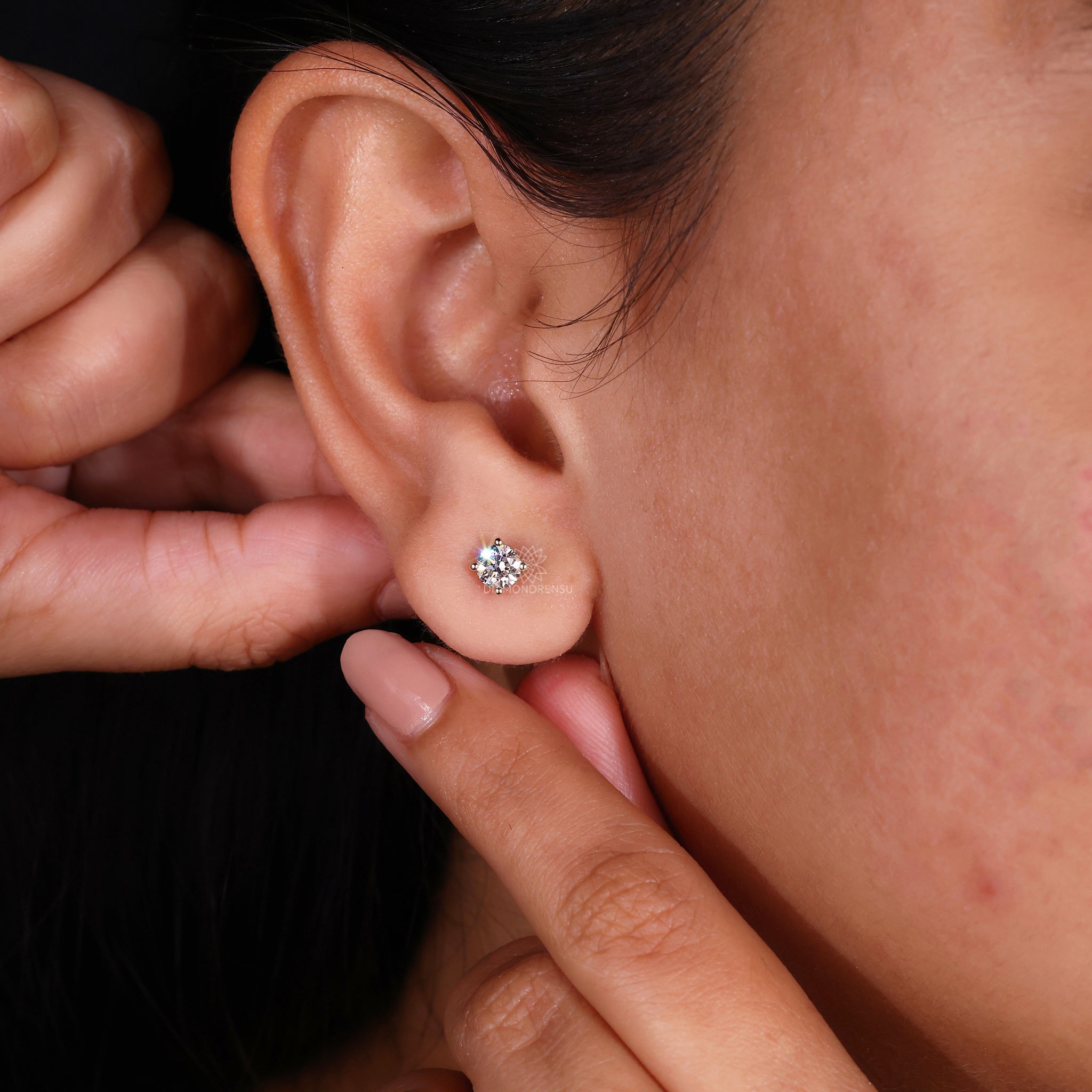 Diamondrensu UK earrings featuring classic round diamond studs in yellow gold.