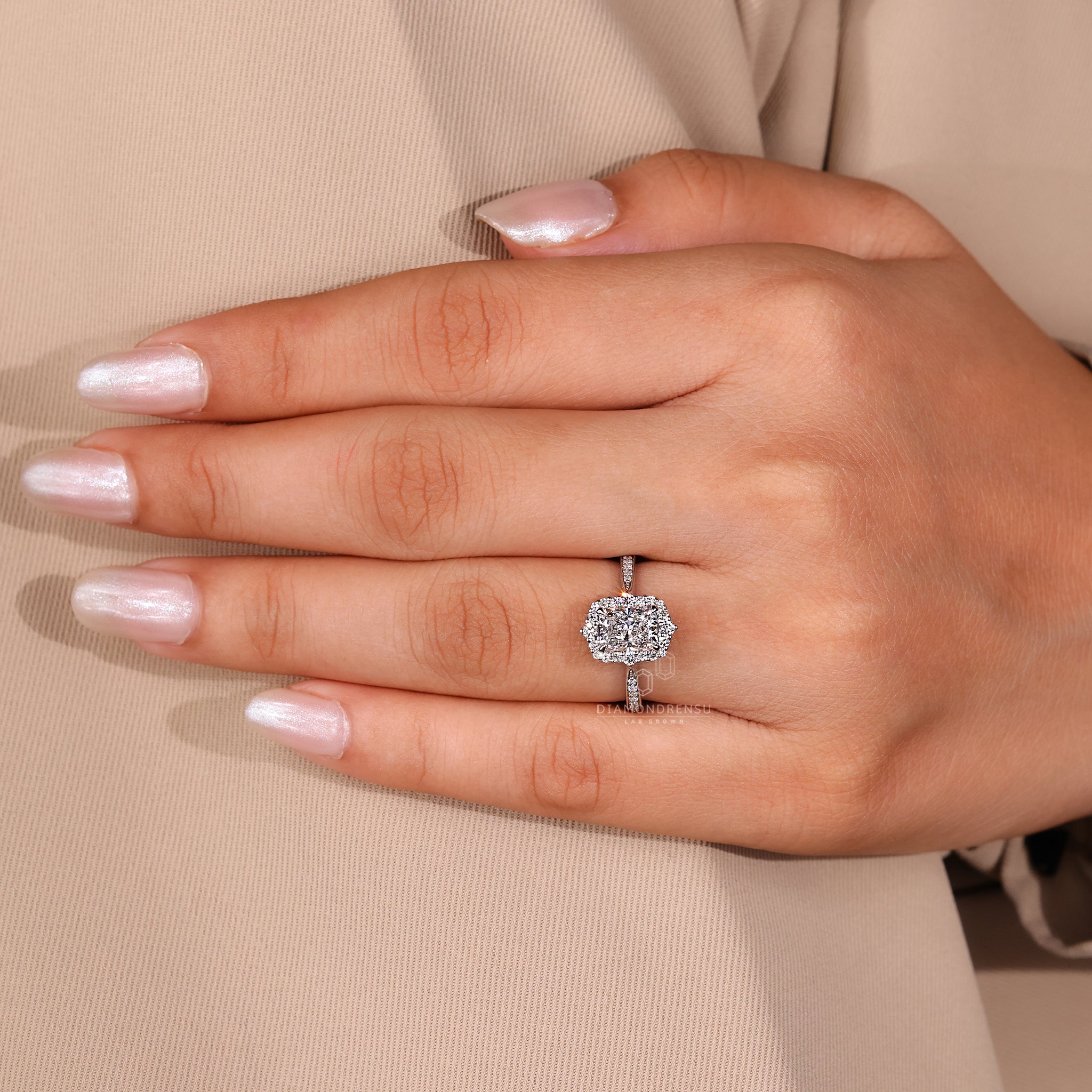 White gold engagement ring with pave band design.
