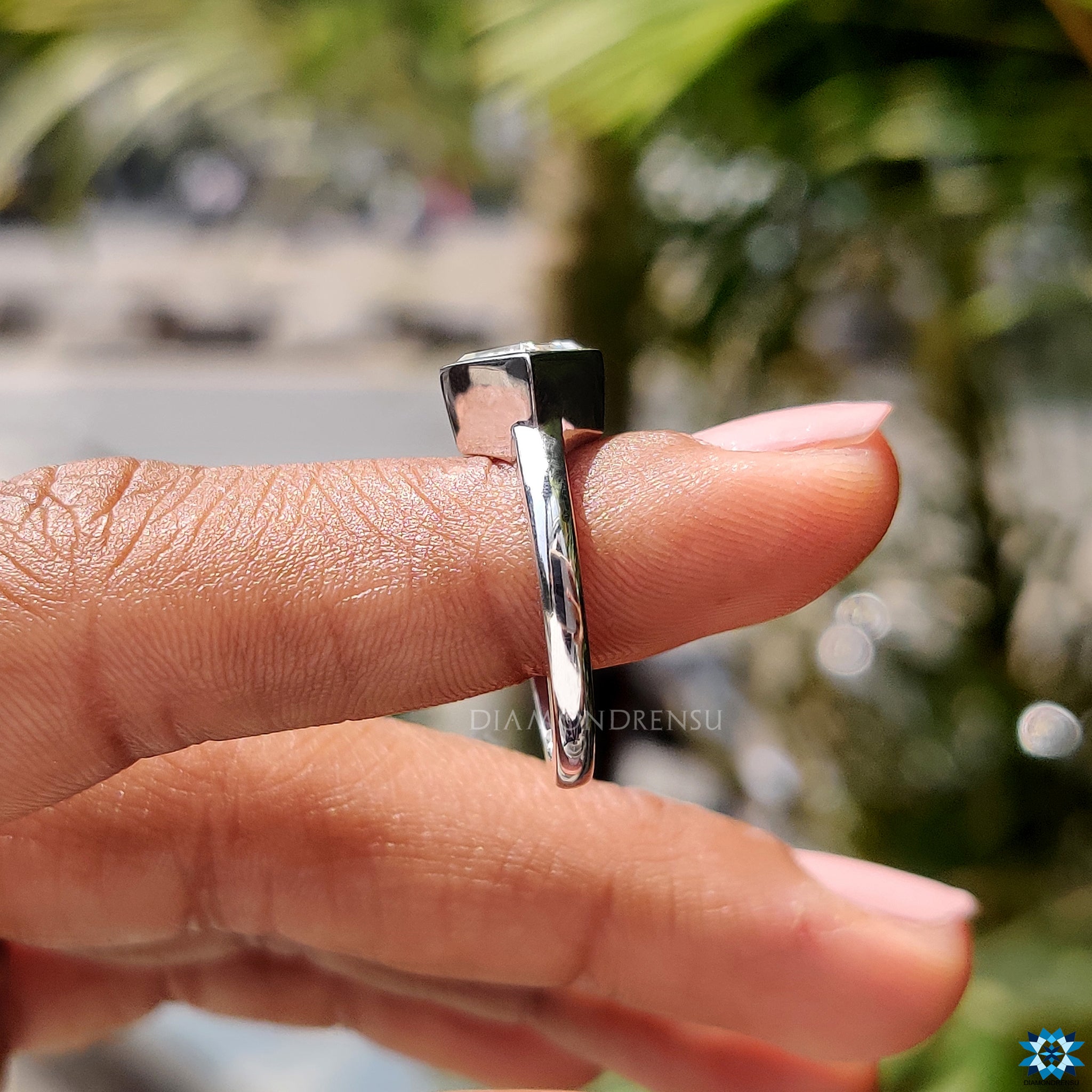 Buy bezel set lozenge cut moissanite engagement ring.
