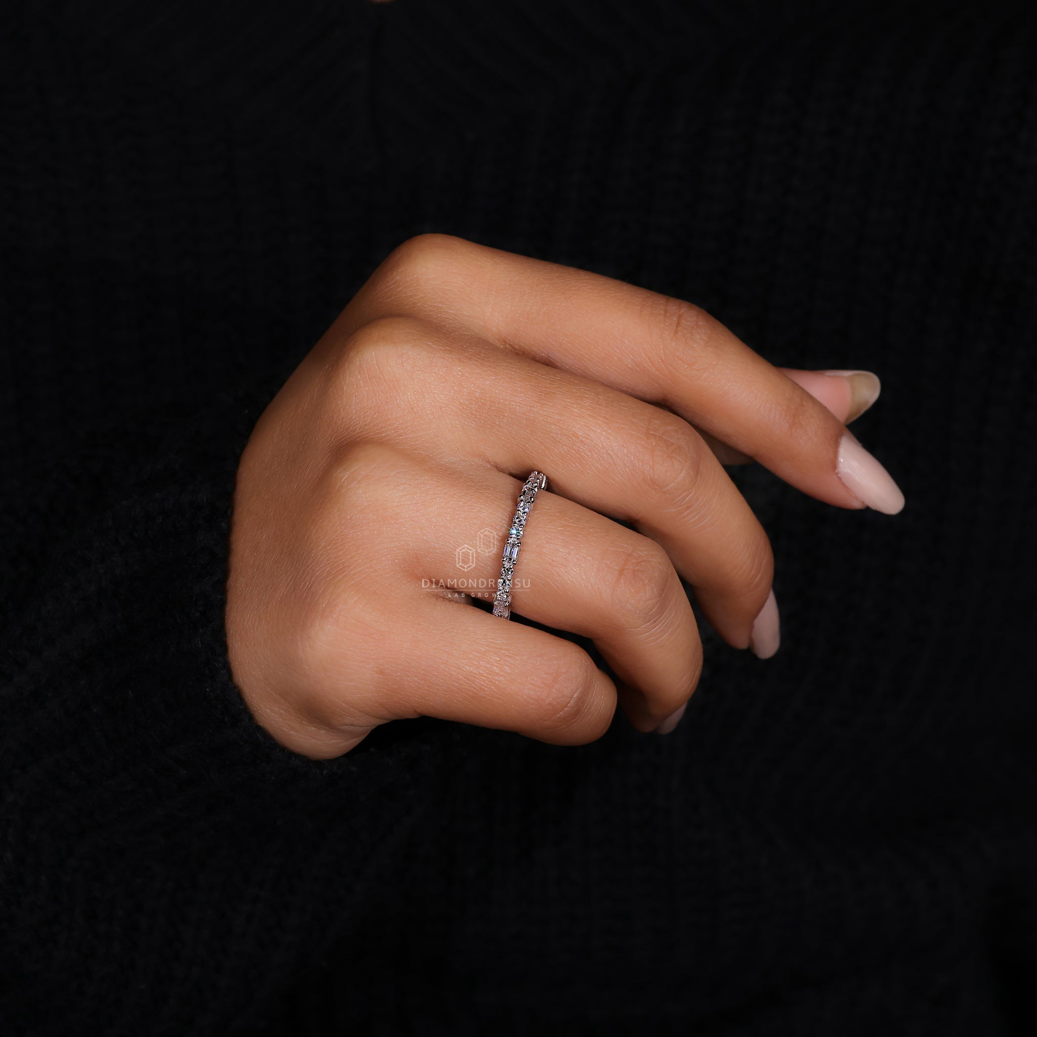 Half eternity white gold wedding band with diamonds.
