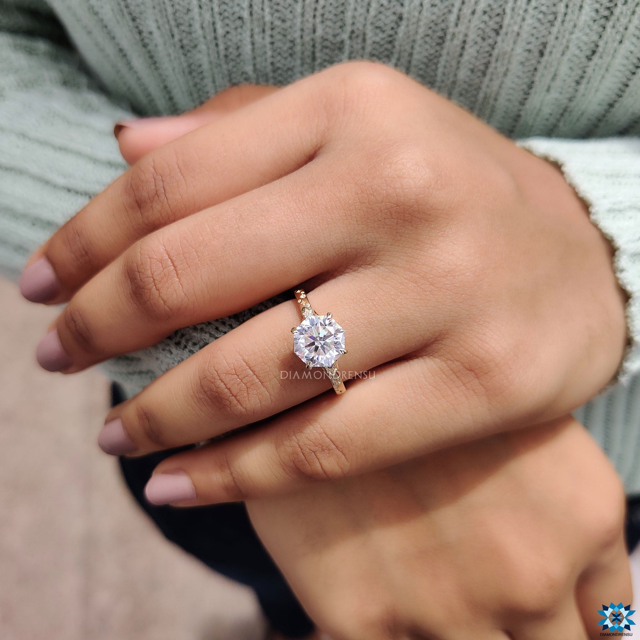 Handmade jewelry featuring octagon moissanite and round side stones.
