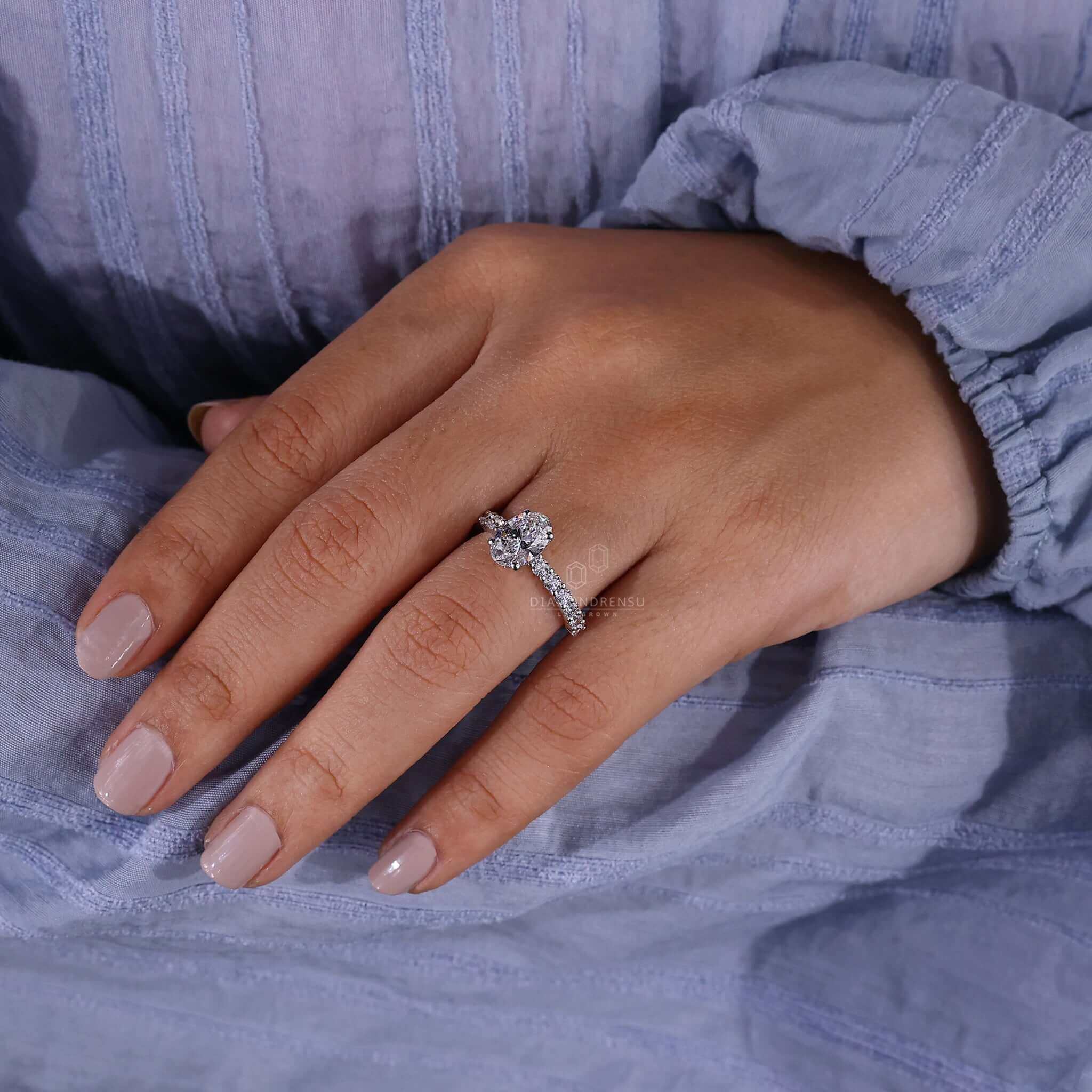 Oval pave engagement ring made from white gold for a radiant finish.