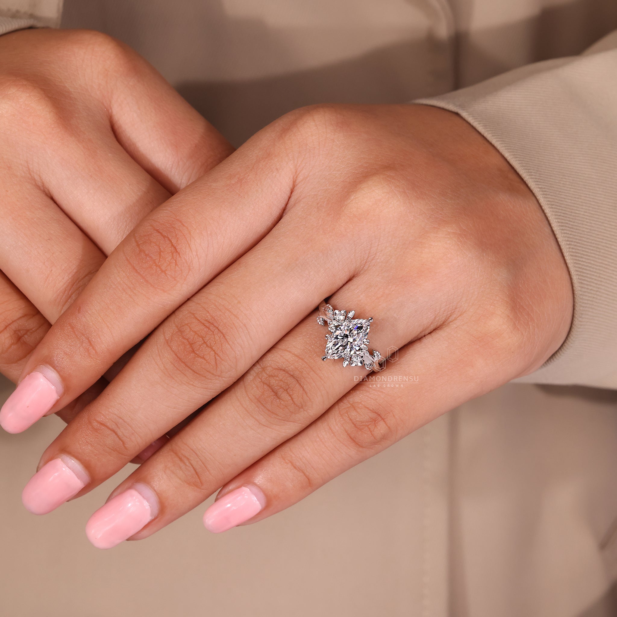 White gold ring with round side stones.
