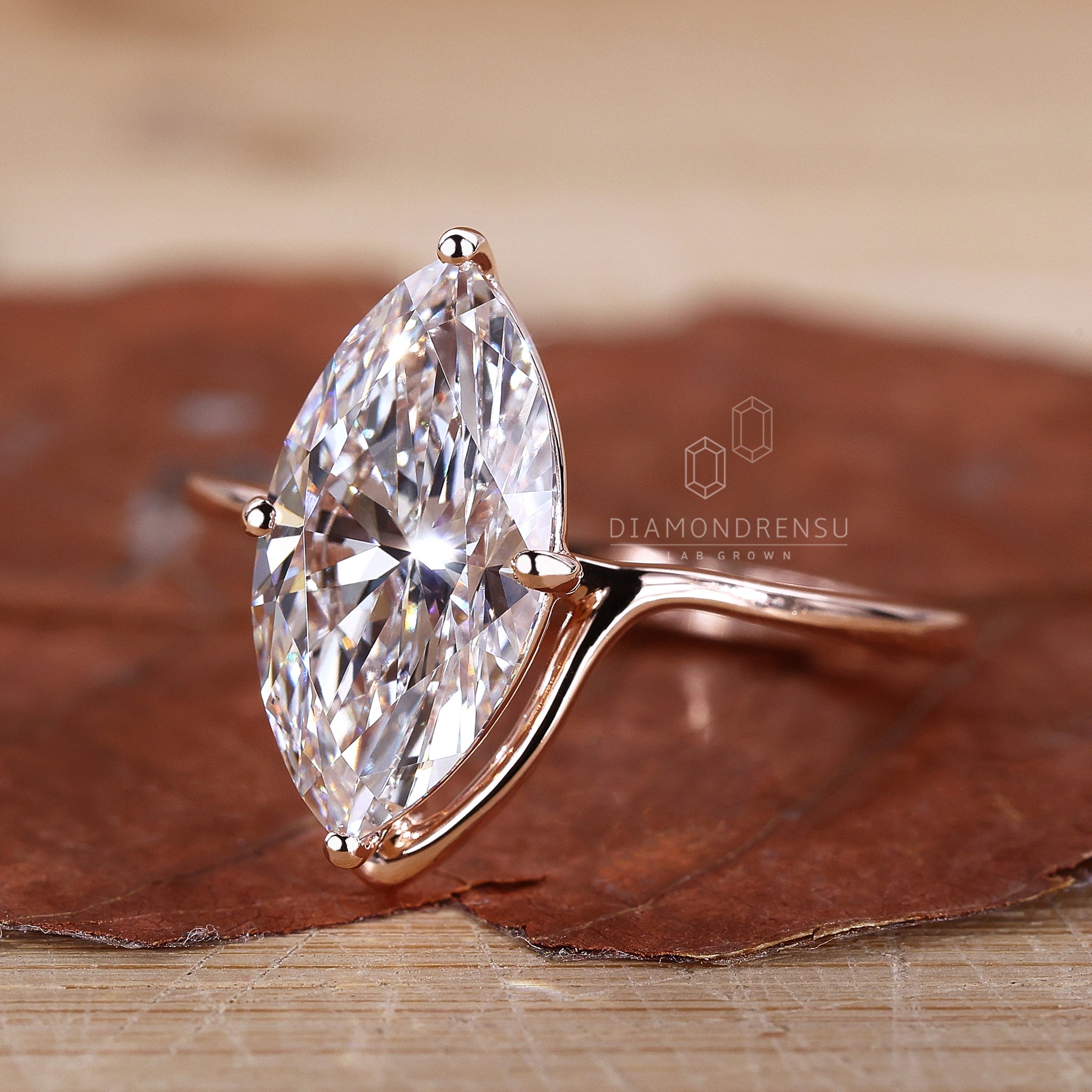 Rose gold ring with a smooth, polished finish.
