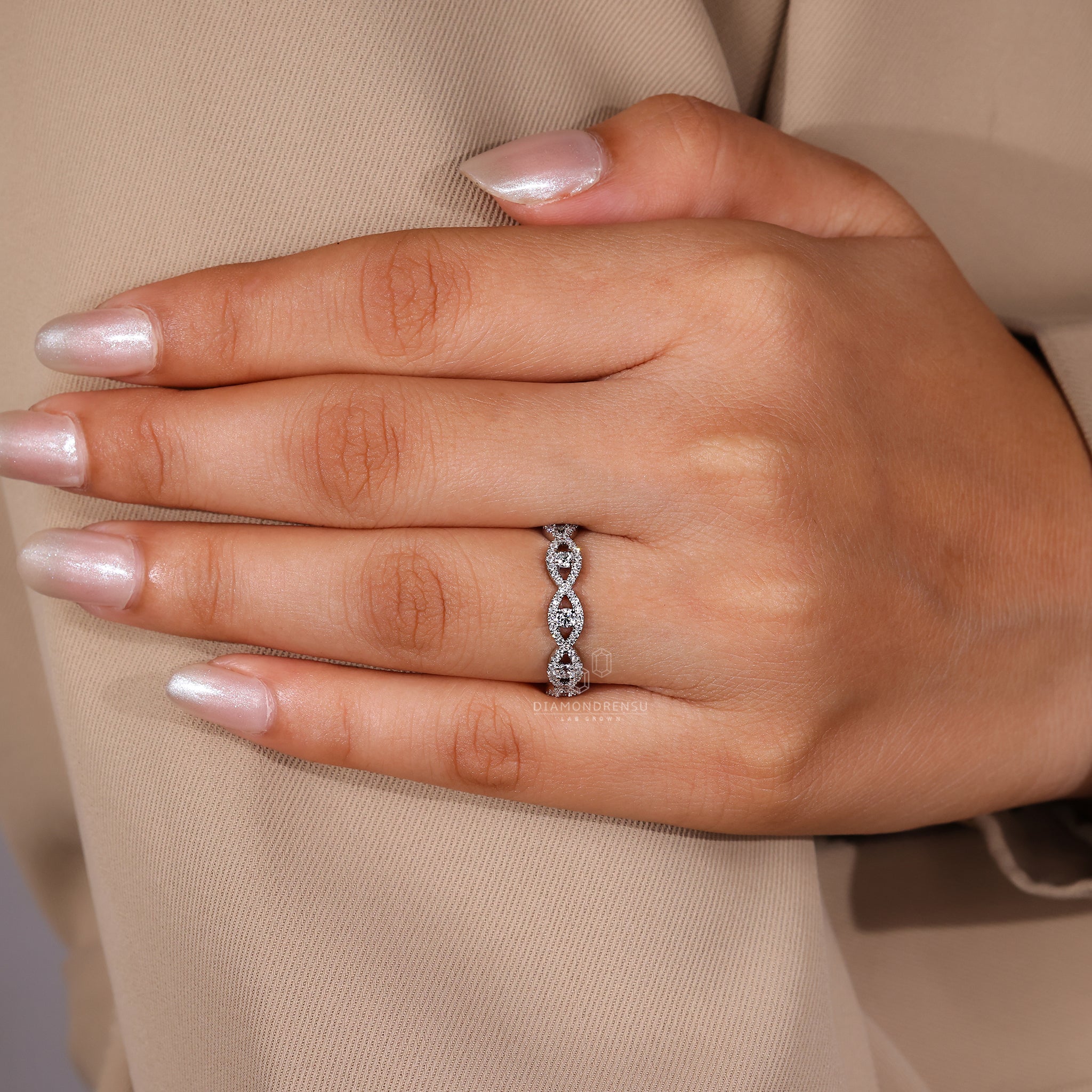 White gold wedding band with round lab grown diamonds.
