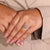 Bypass halo setting ring adds a stylish shape to the design.
