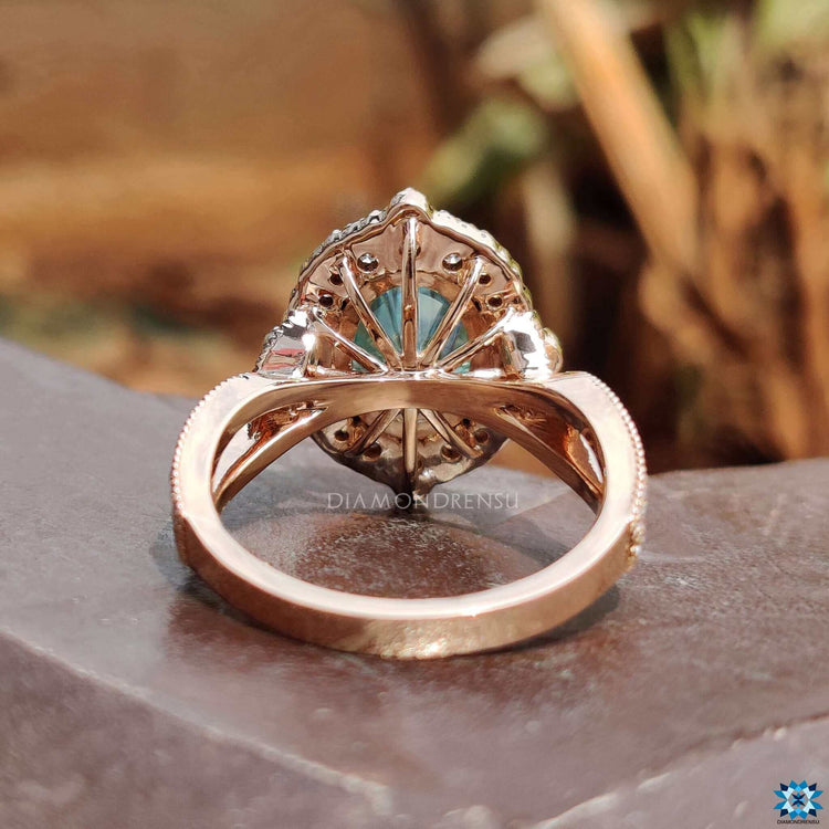 Cyan blue moissanite center stone in oval cut.
