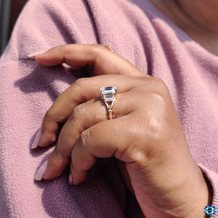 Five stone engagement ring with baguette side stones.
