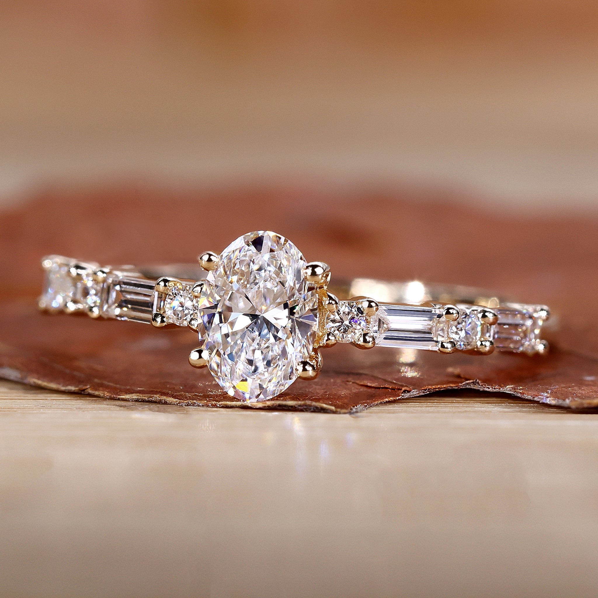 Oval diamond engagement ring with pave band.
