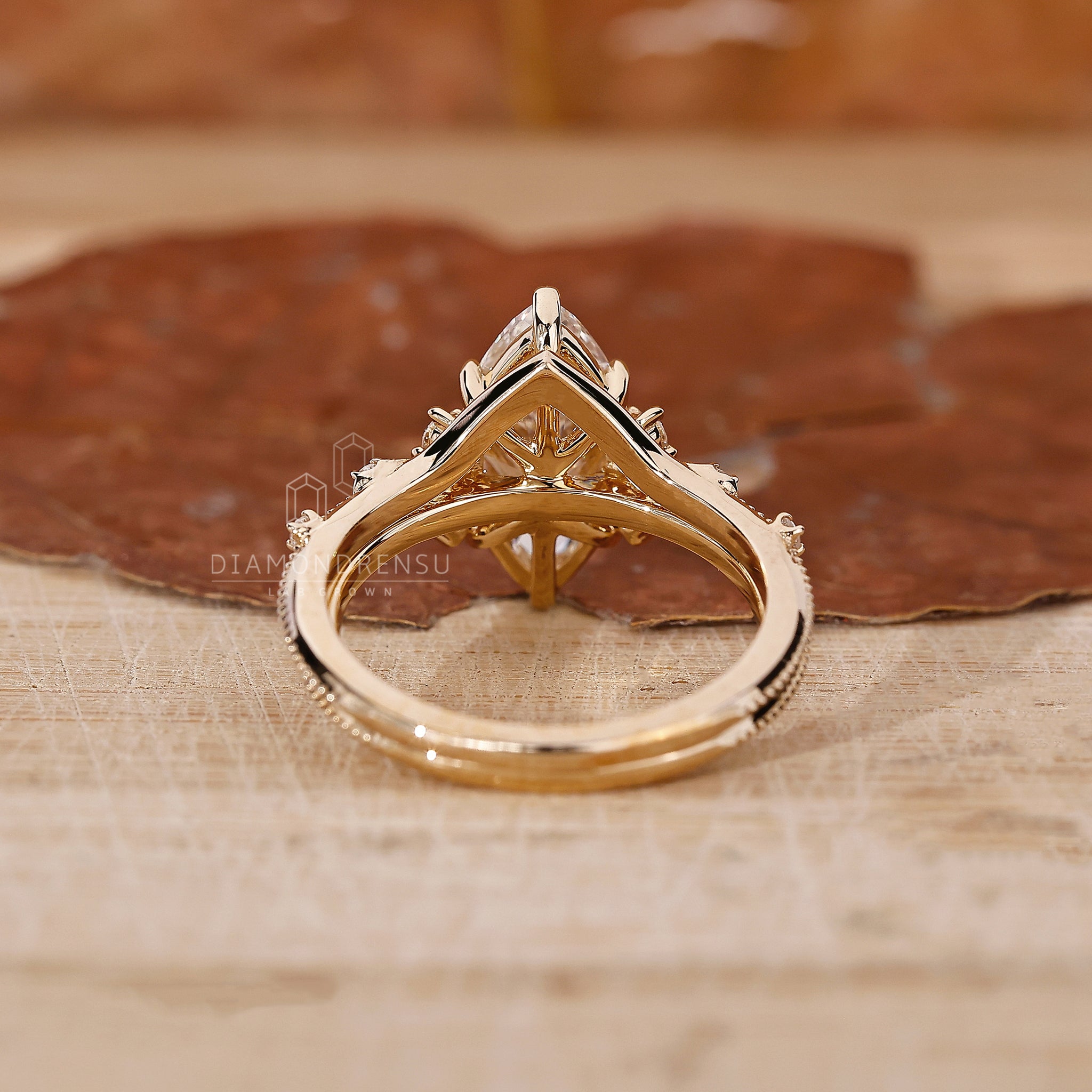 Milgrain wedding band with stackable wedding band and marquise centre stone ring.
