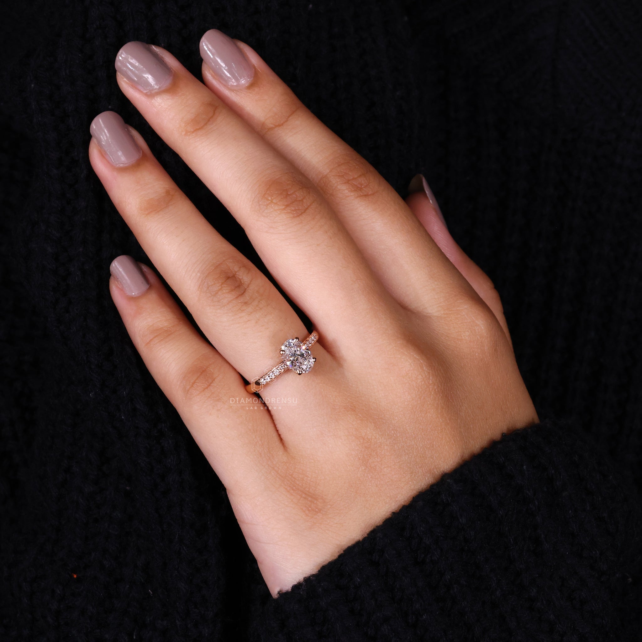 Model showcasing a pair of custom diamond wedding earrings, designed with lab grown diamonds to match personal preferences.