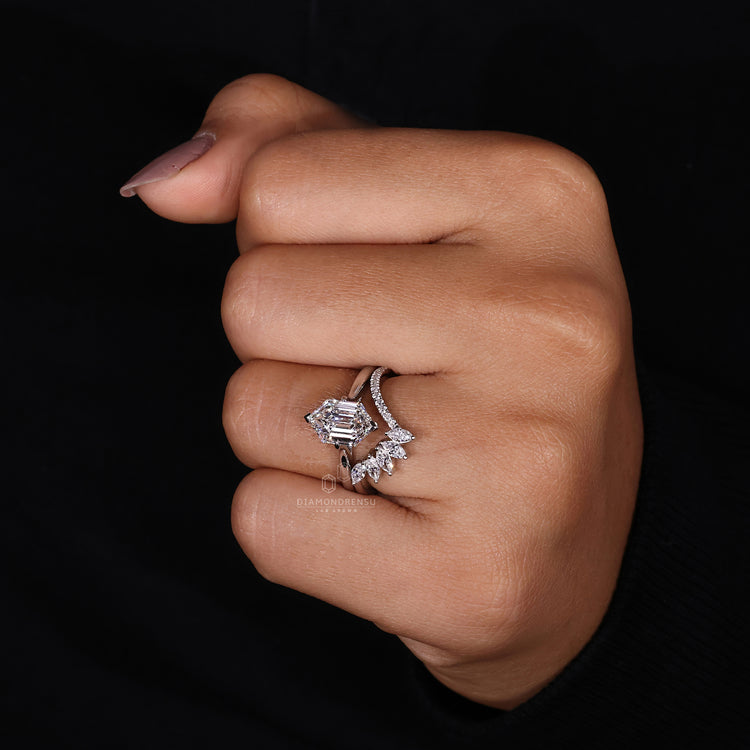 Buy bridal set featuring a hexagon step cut centre stone and compass setting.
