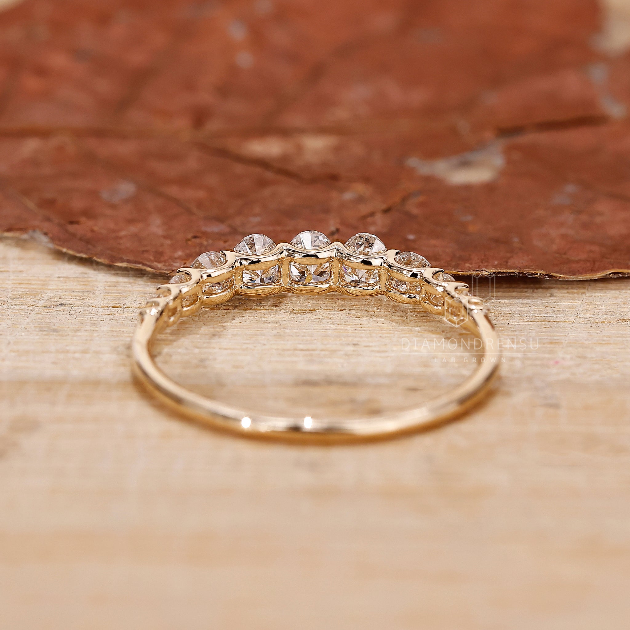 Prong setting half eternity diamond band.
