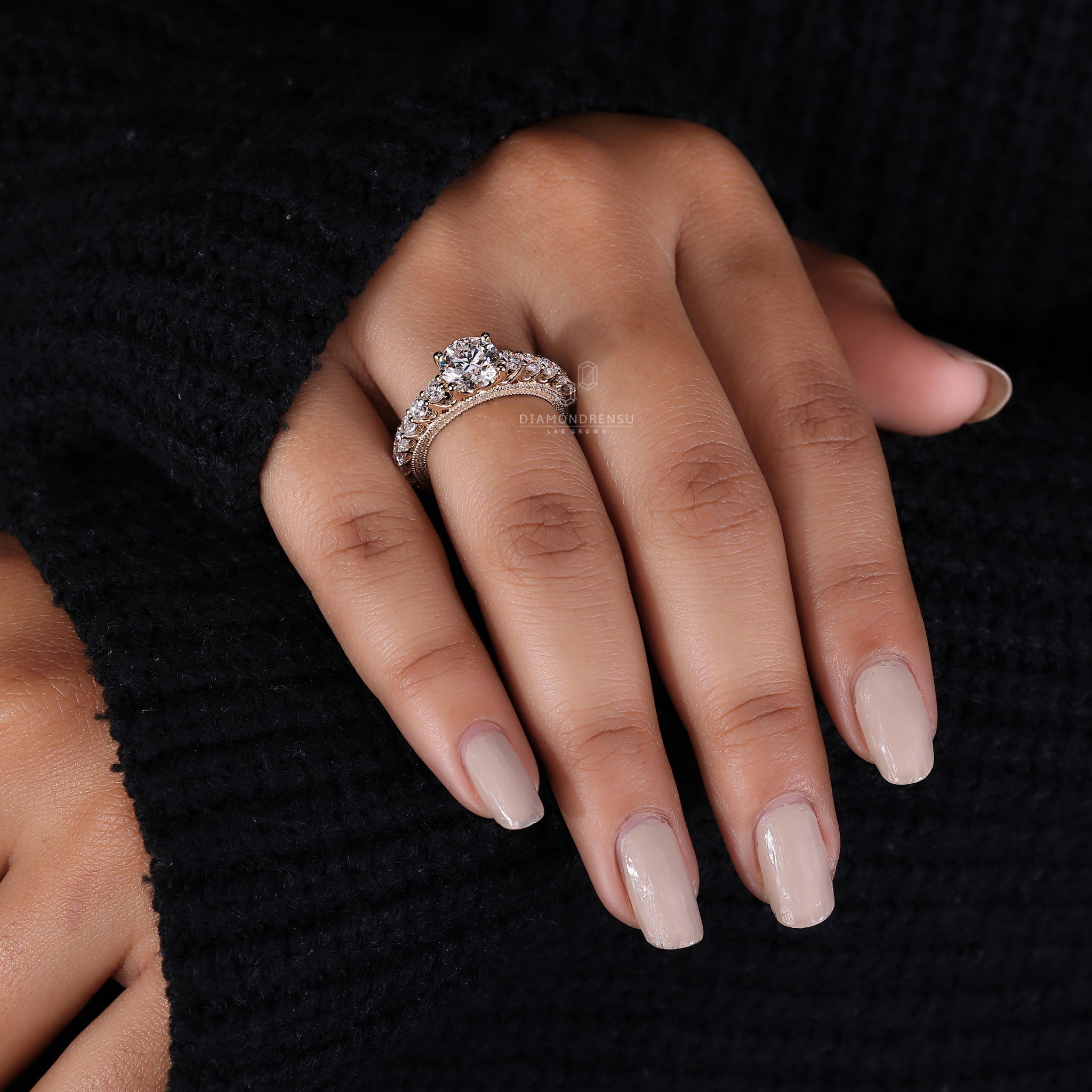 Handmade ring with pave setting and lab grown diamond.
