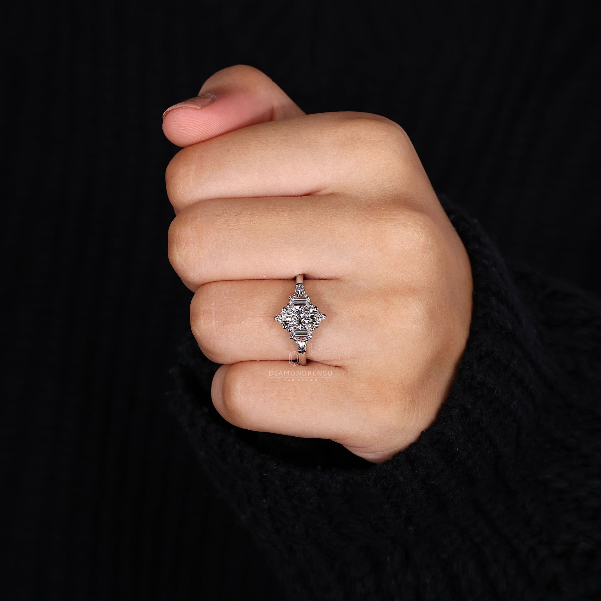 Diamond ring UK has a tapered baguette and marquise diamond combination.
