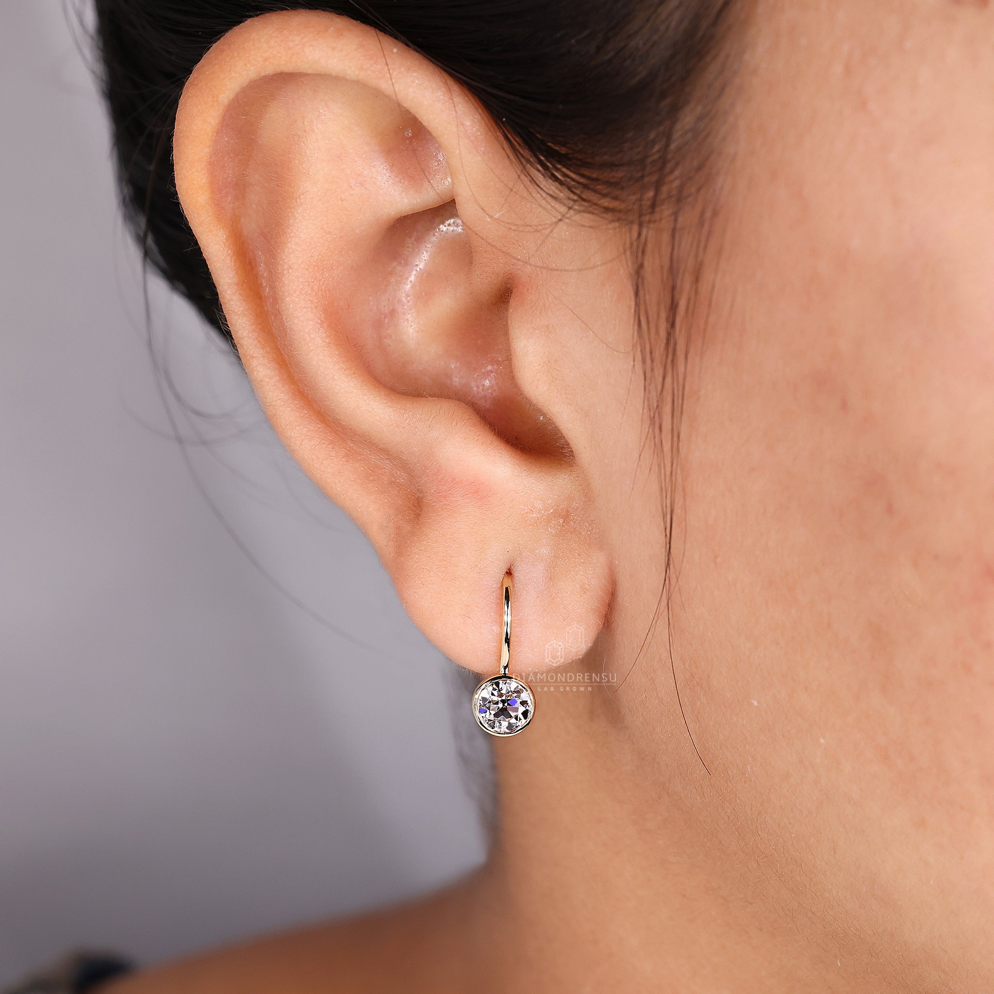 Round old European cut diamond studs.