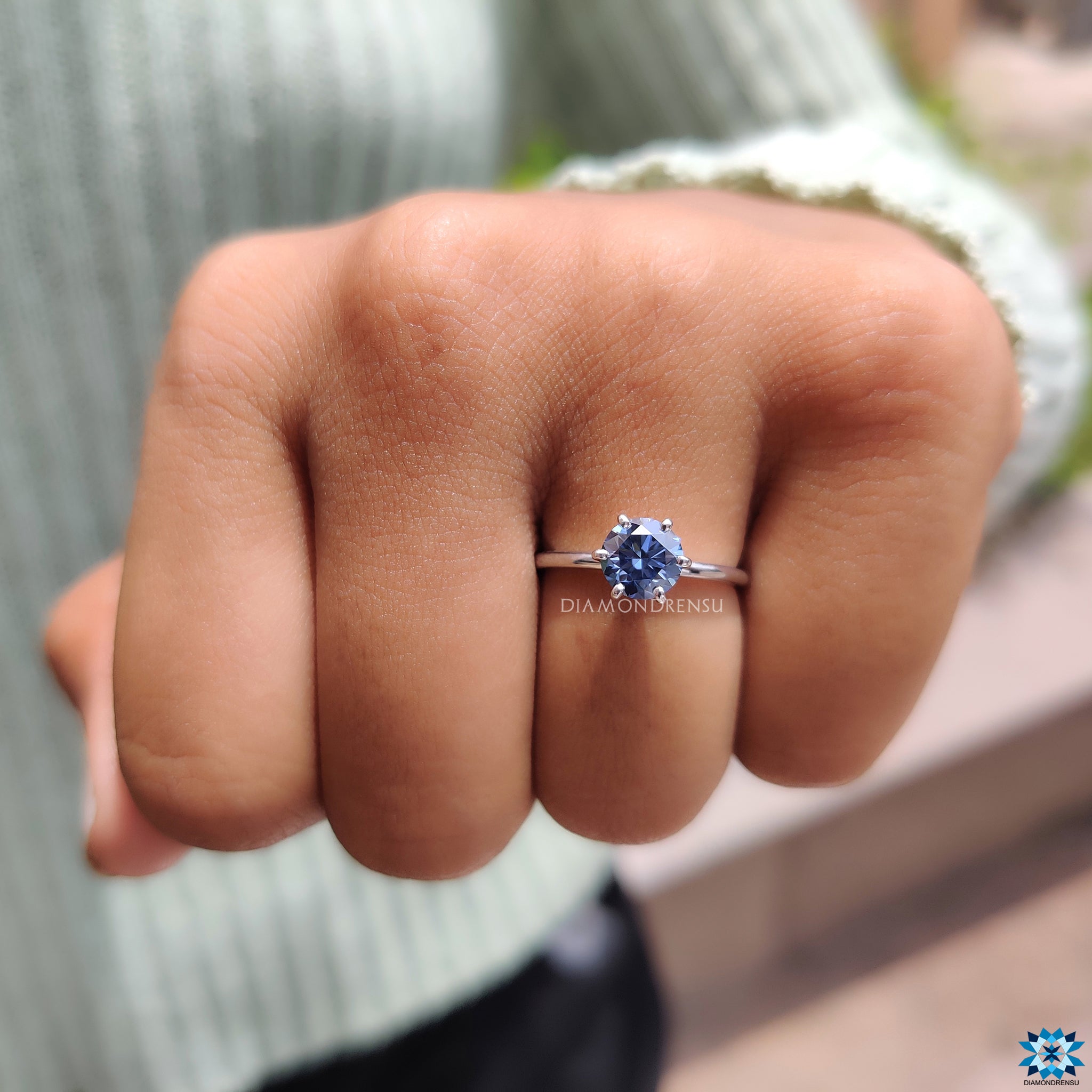 Handmade jewellery piece with round cut moissanite and secure claw setting.
