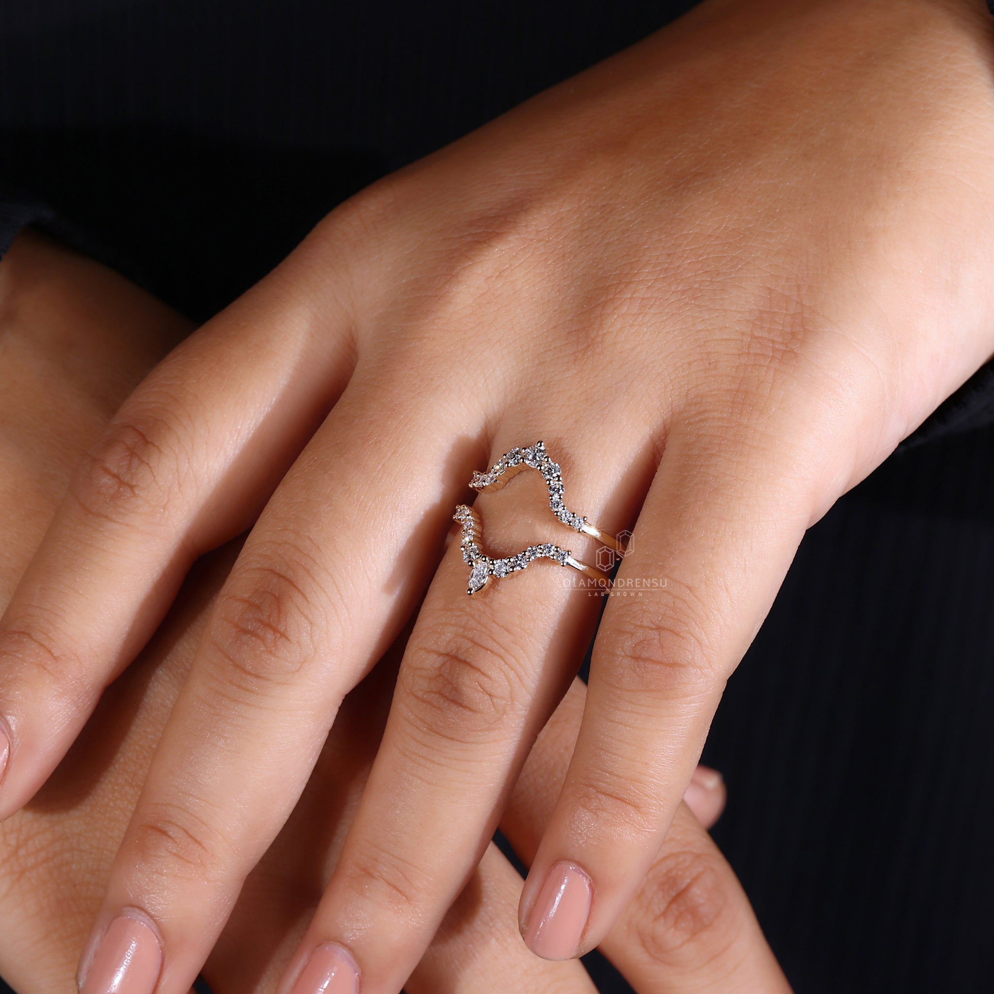 Enhancer wedding band with marquise cut diamonds.
