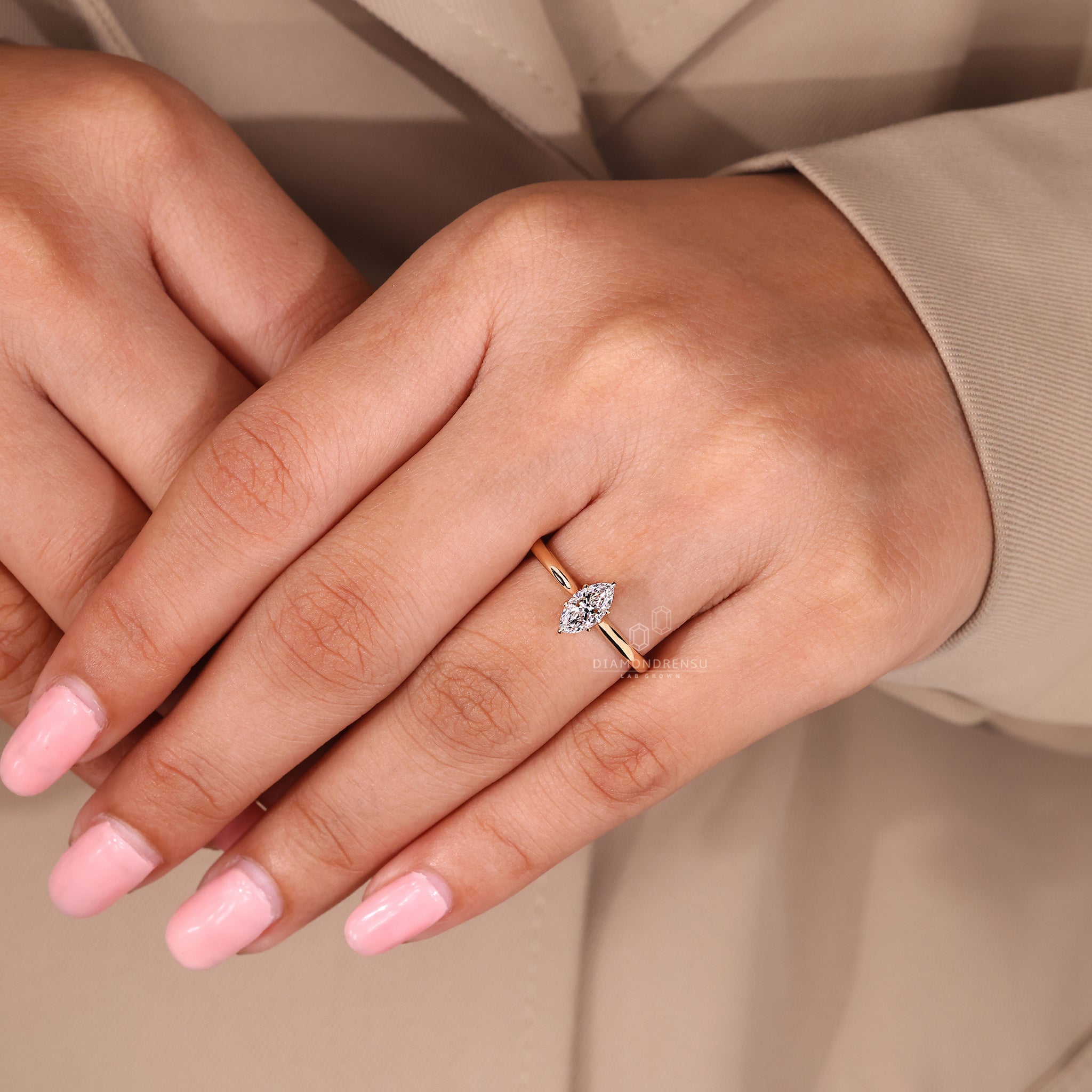 Marquise diamond ring with yellow gold band.
