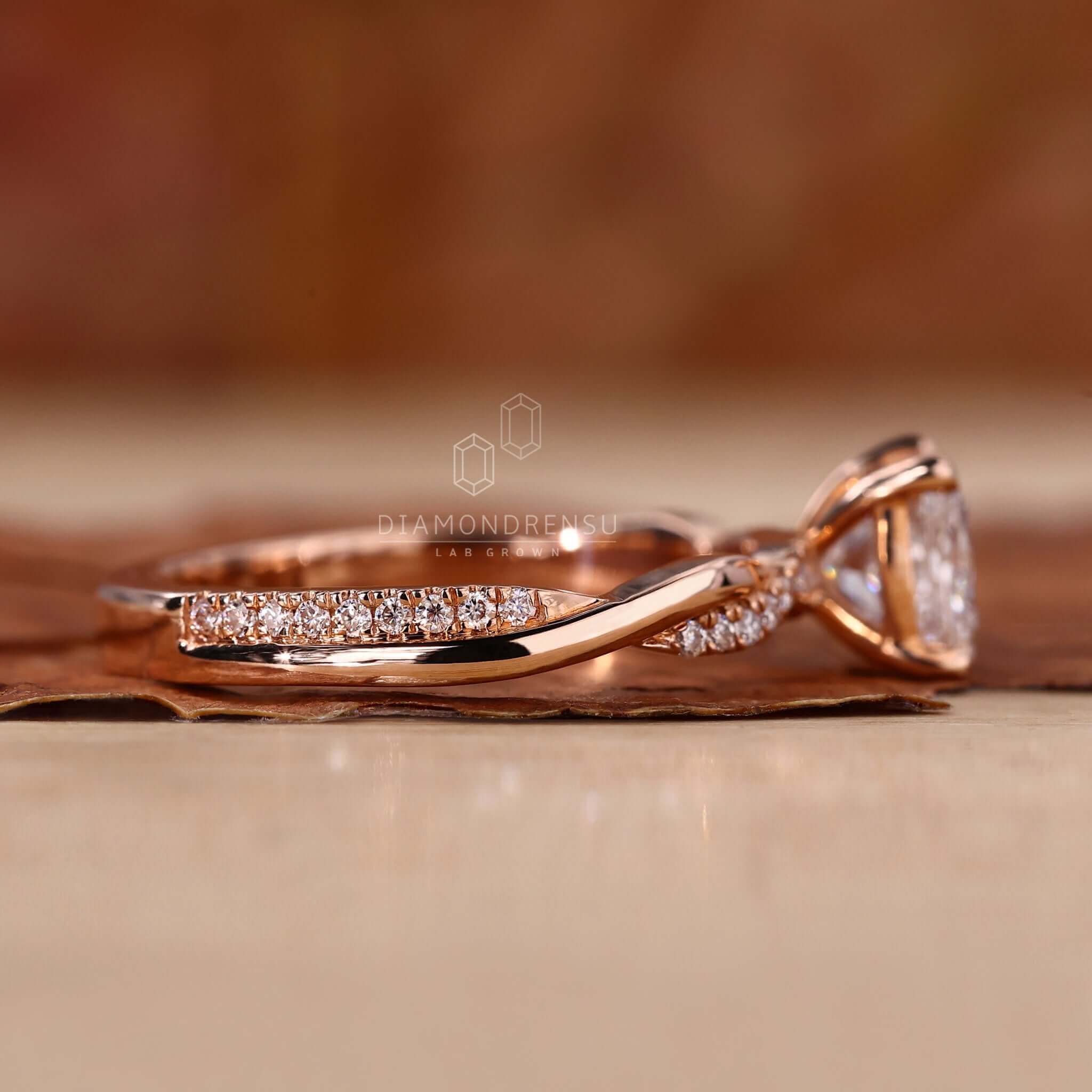 Twisted ring paired with a 1 ct princess cut diamond ring in a rose gold setting.