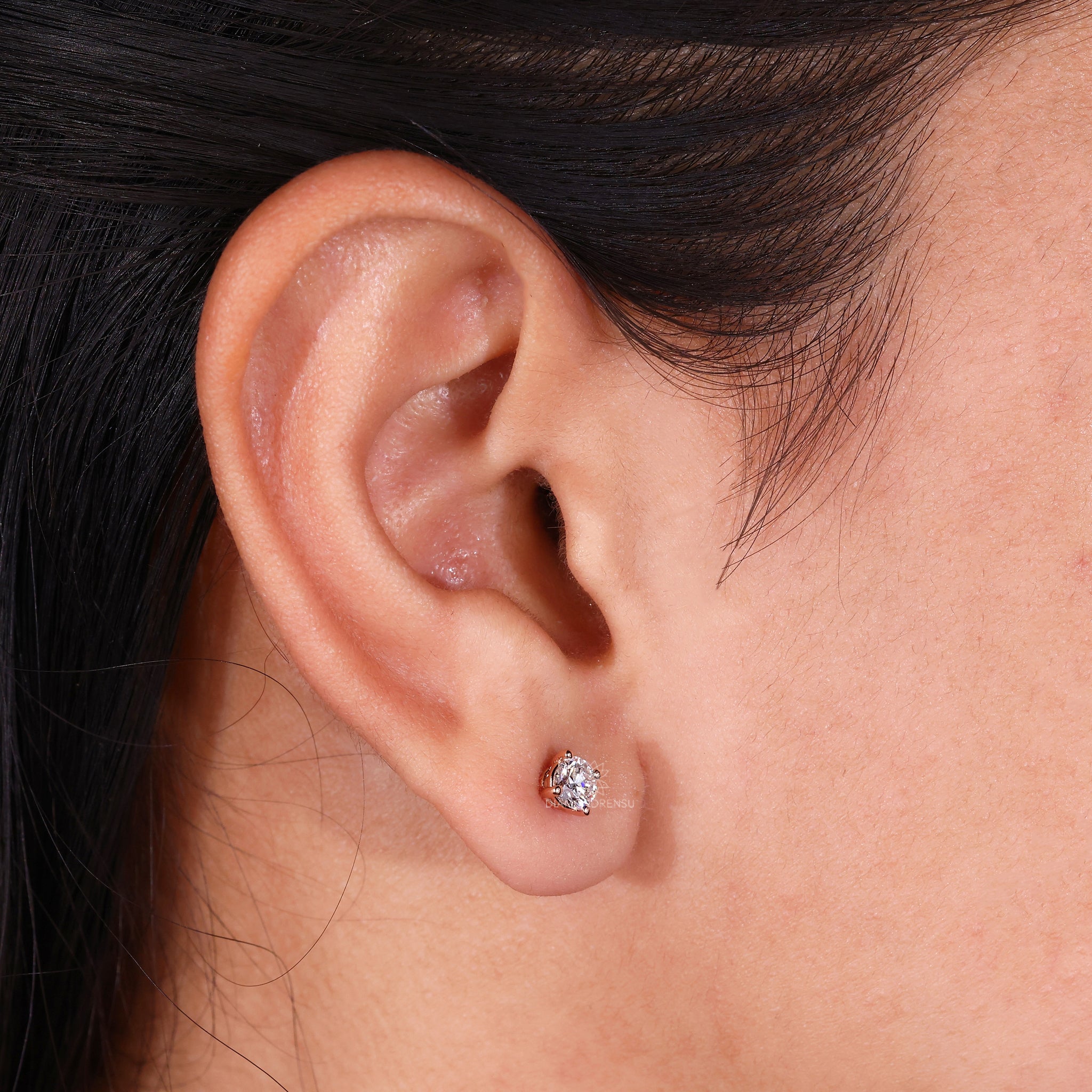 Lab grown diamond earrings in rose gold with a delicate prong setting.