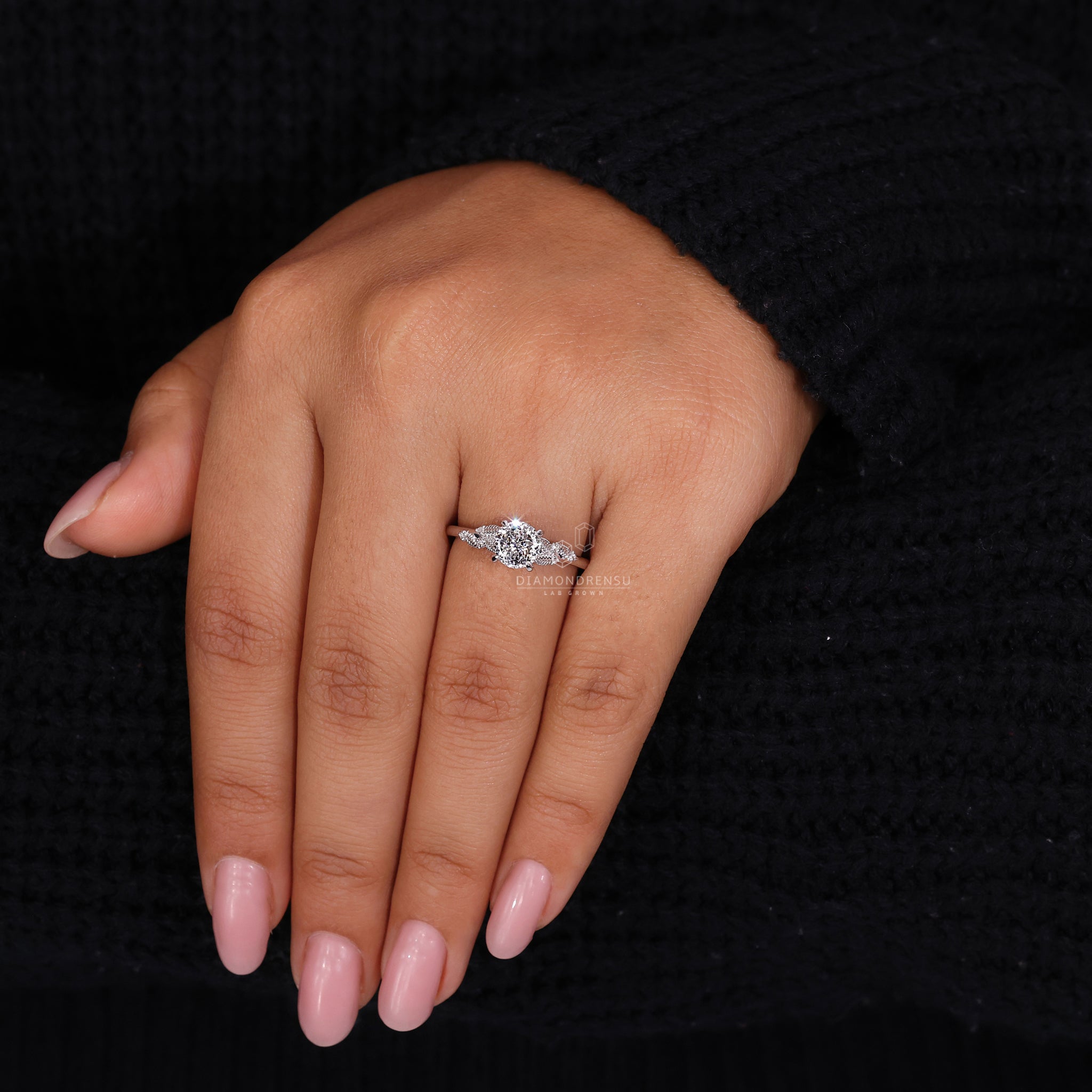 UK engagement ring with peekaboo ring style and Portuguese center diamond.
