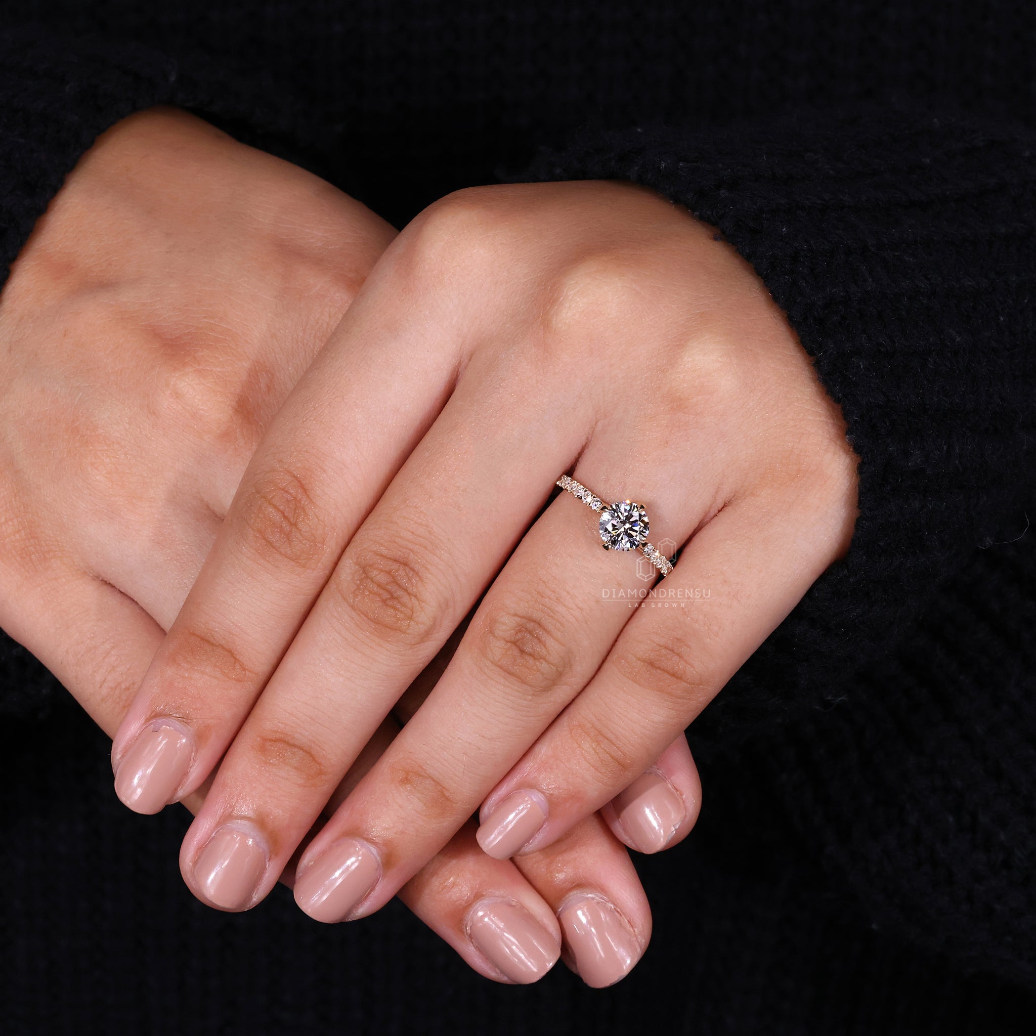 Custom engagement ring with four claw prong set and compass prong setting.
