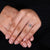 Custom engagement ring with four claw prong set and compass prong setting.
