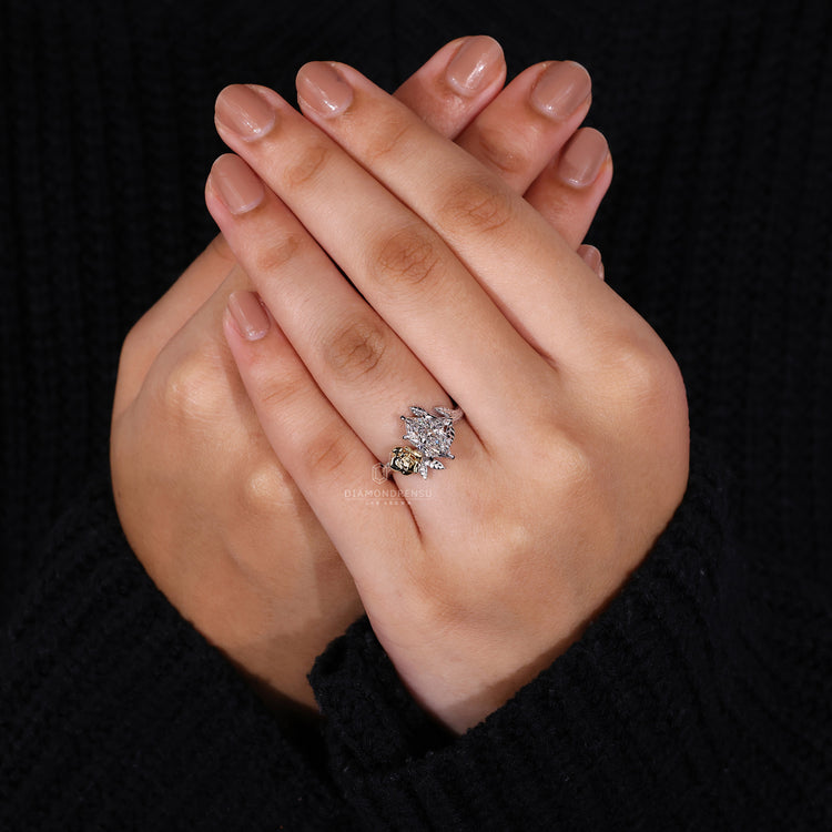 Rose inspired engagement ring in white and yellow gold with IGI certified diamond.
