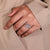 Custom engagement ring featuring cathedral setting and claw prongs setting.
