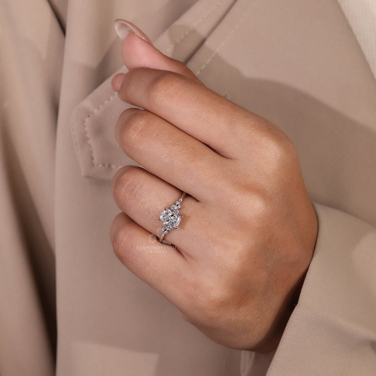 IGI certified engagement ring with round side stone layout.
