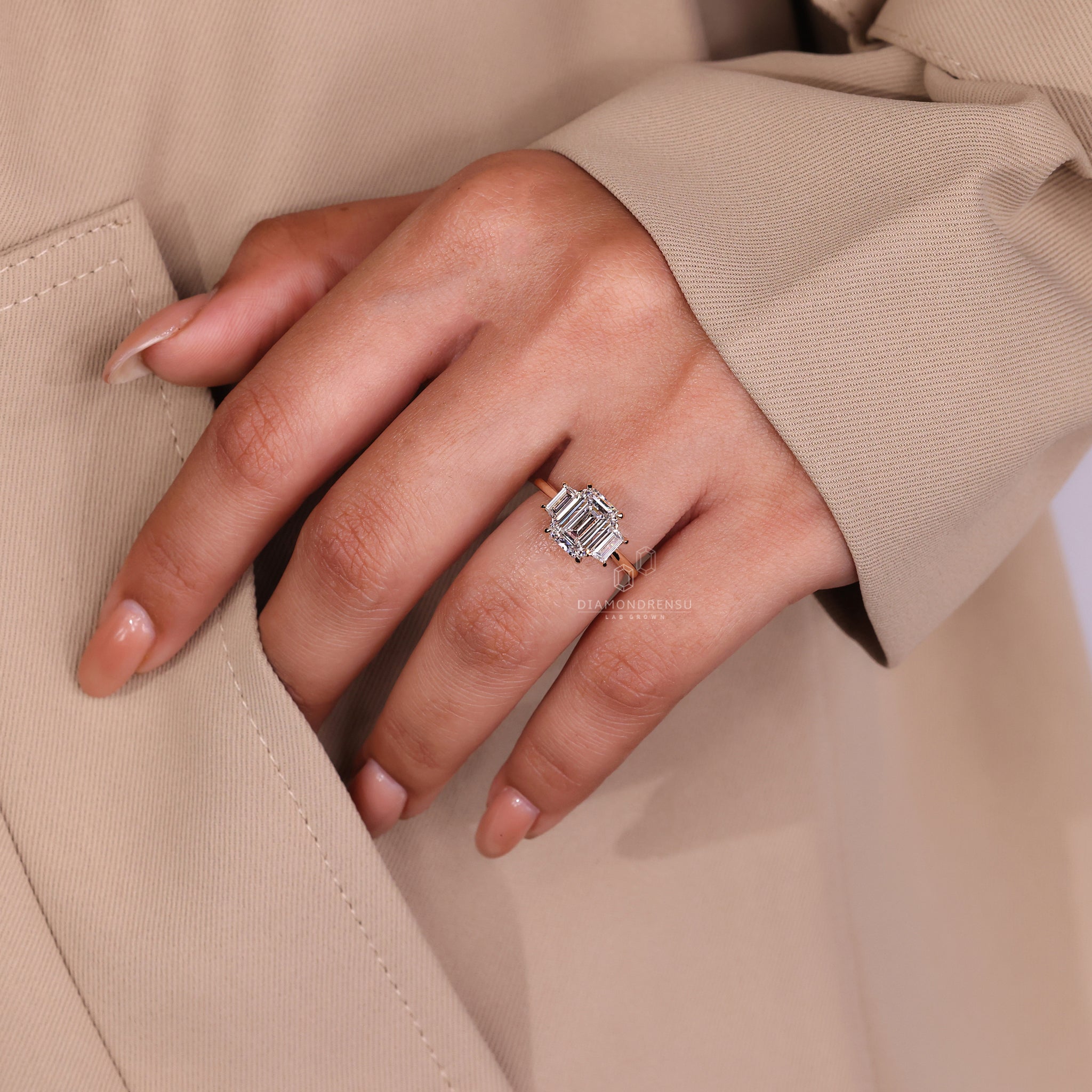 Engage Ring UK shows this three stone style in yellow gold.
